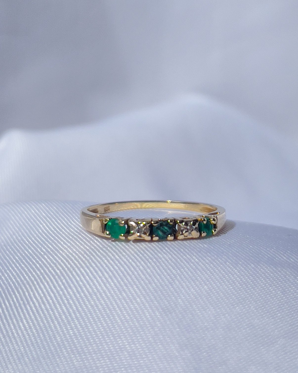 "Gala" emerald & diamond half wedding band