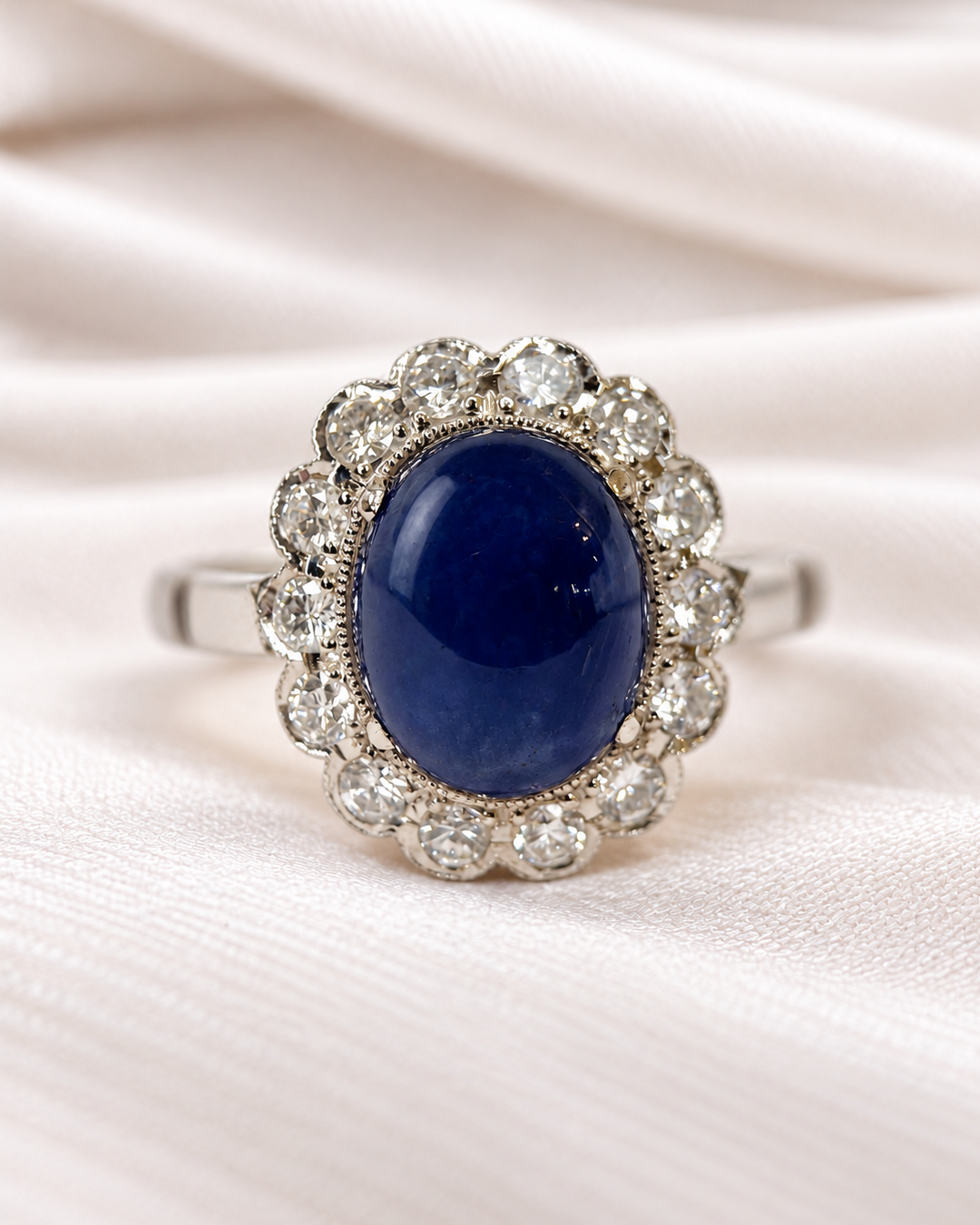 “Patricia” Marguerite ring with a 5.25-carat cabochon sapphire and 0.42-carat diamonds