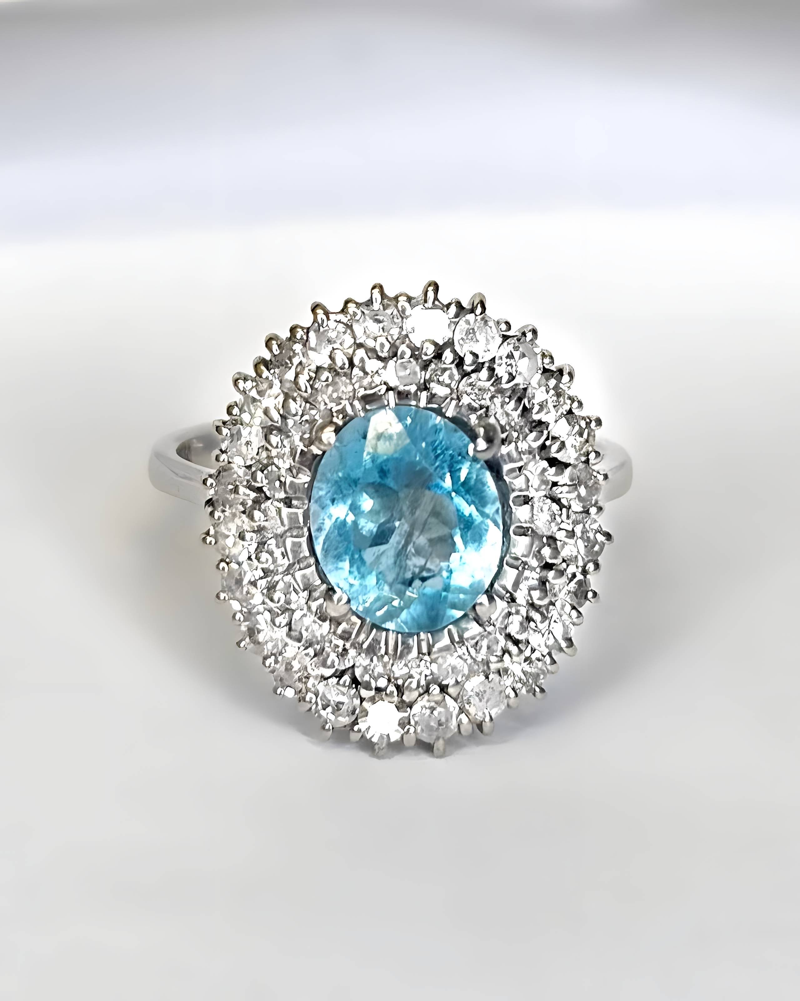 “Deva” Daisy Ring with a 1.60-carat Aquamarine and 0.96 Carat of Diamonds, 5.82 g