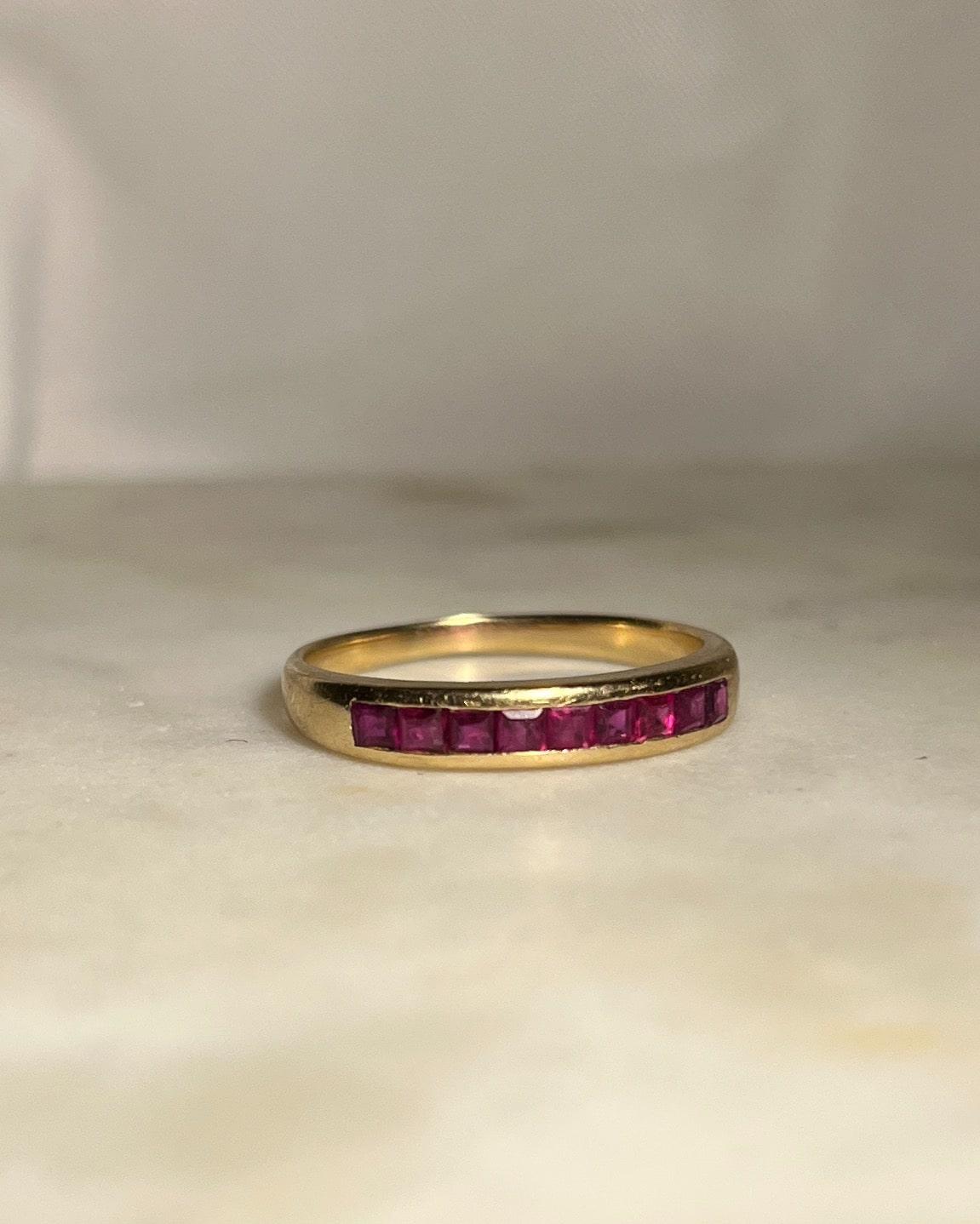 Half calibrated ruby ​​wedding ring "Brunila"