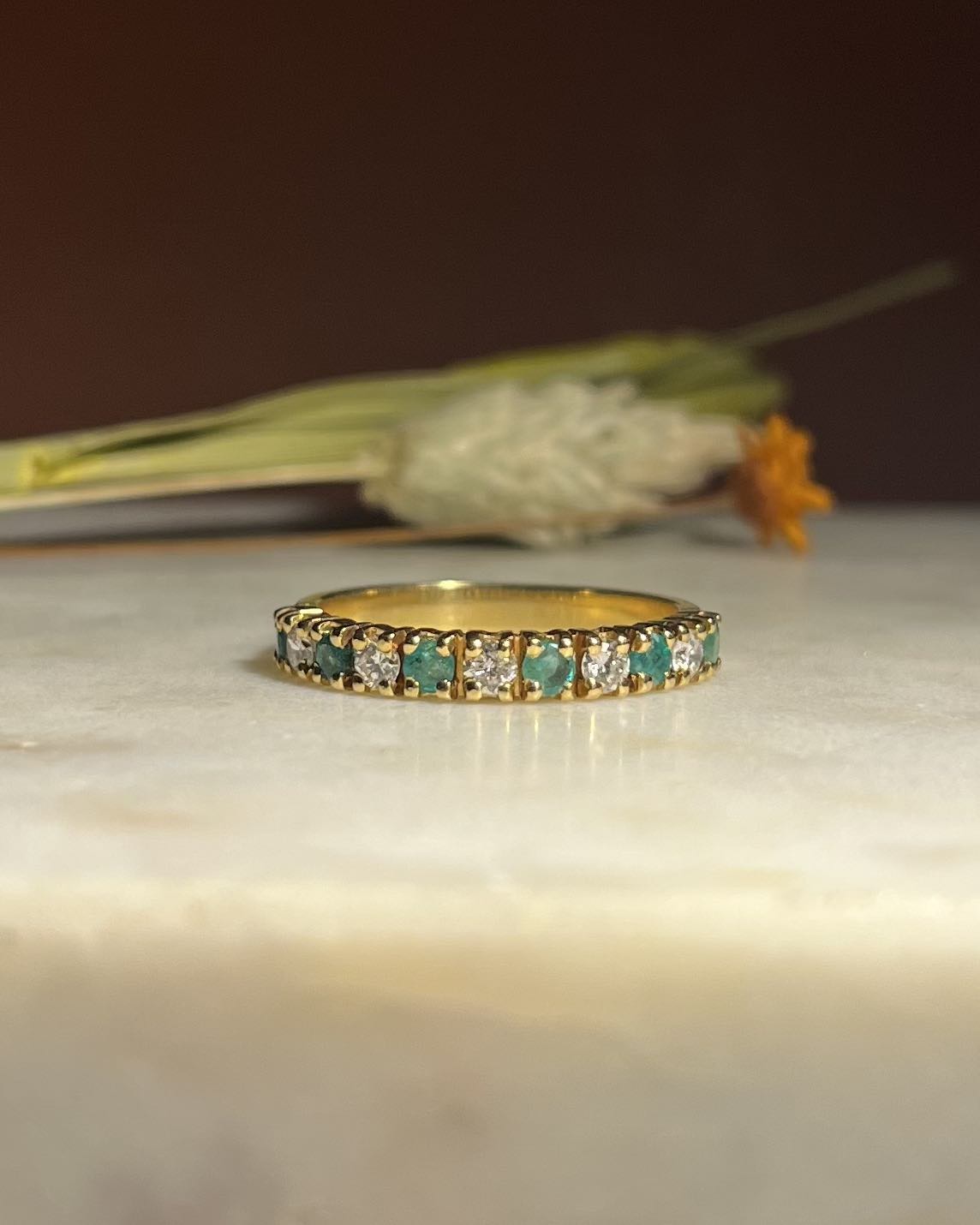 "Marine" emerald and diamond river ring
